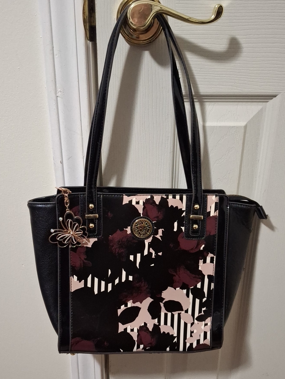 Anne Klein Black Tote with Pink & Burgundy Floral Print and Butterfly Zip Pull